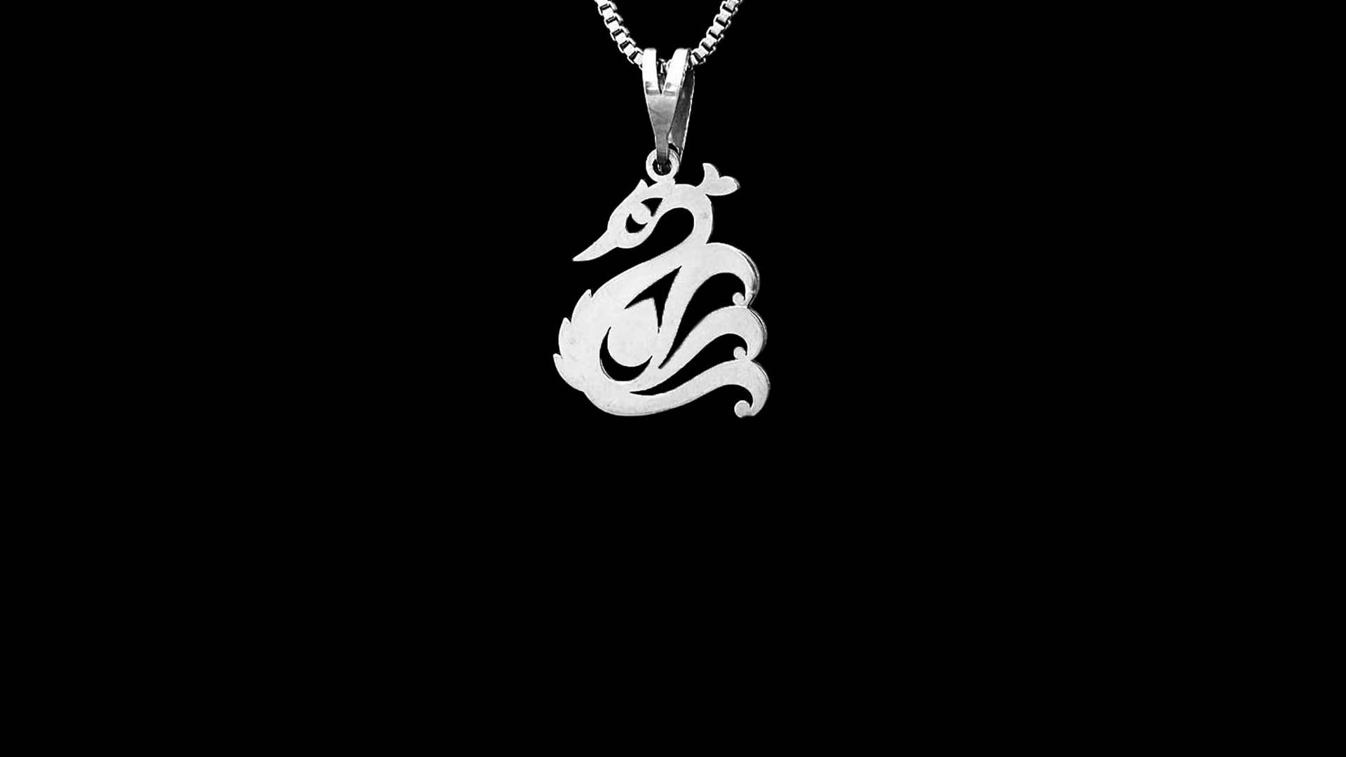 Pendant close-up on dark metal