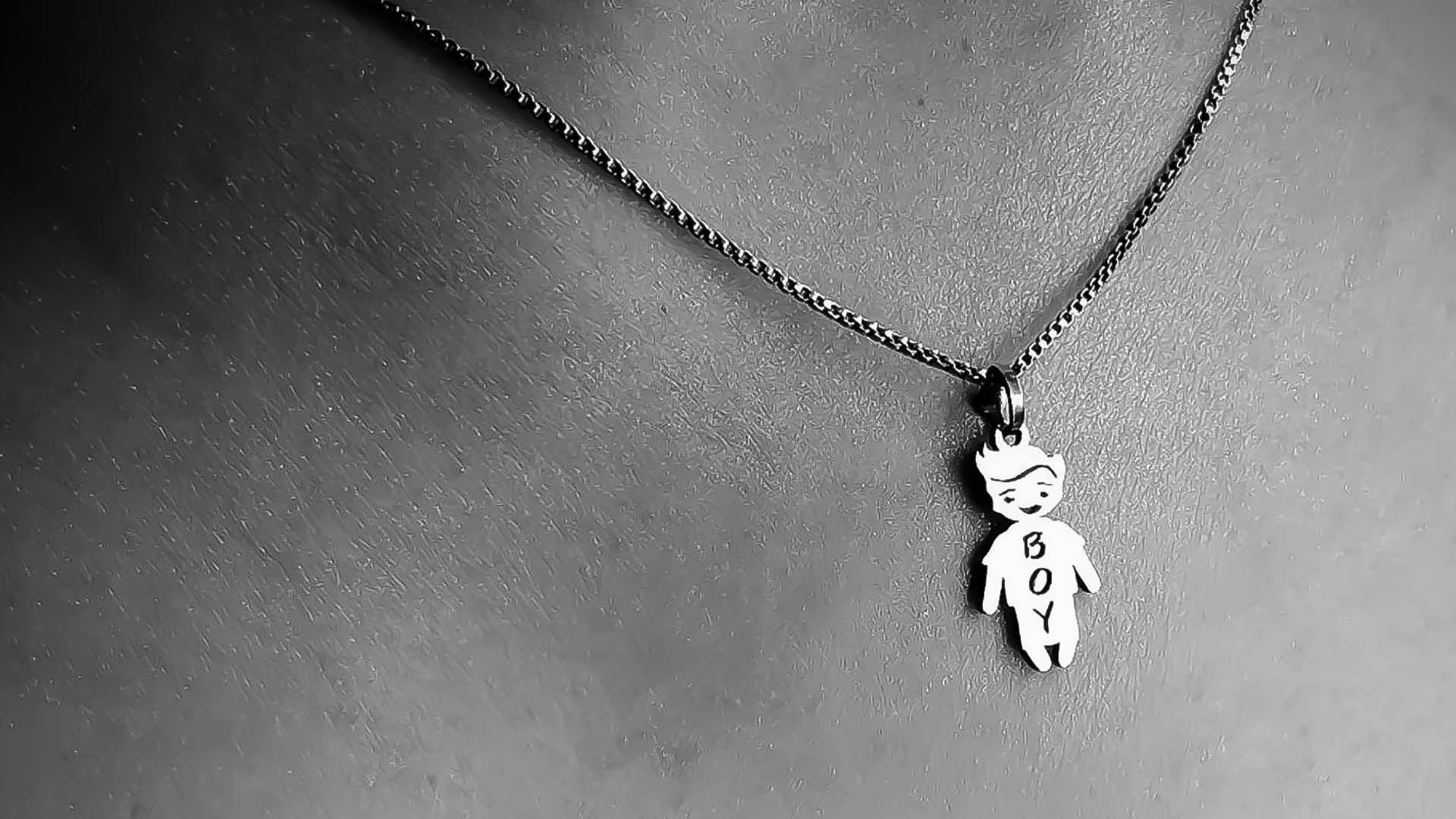Name pendant on fabric